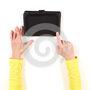 Hands in yellow jacket and tablet