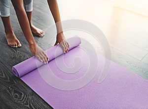 Hands, yoga mat and roll on floor for exercise, meditation or spiritual training in home, gym or living room. Woman