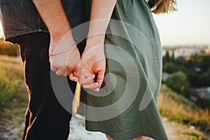 Hands of a young couple. Gentle touch, romantic moment. Close-up.