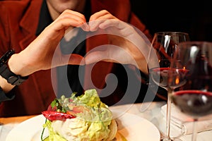 Hands man, depicting heart