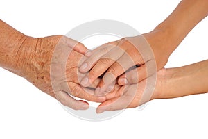 Hands of young and senior women