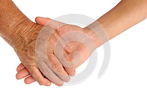 Hands of young and senior women