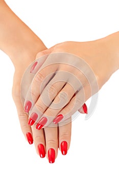 Hands of a young women. Red nail polish