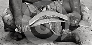 Hands of Yugambeh Aboriginal worrior man holds boomerangs