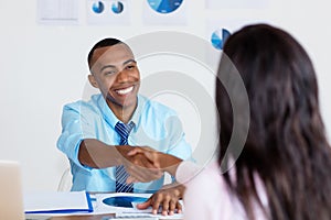 Handshake of african american businesspeople after signing contract