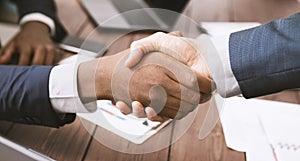 Handshake of african american and caucasian business partners