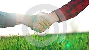 handshake agriculture. hands of group farmer business make a contract in the field. farmer handshake hands shaking hands