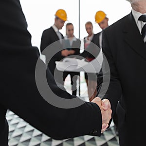 Handshake of architect and investor