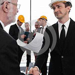 Handshake of architect and investor