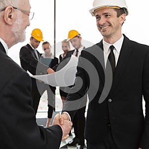 Handshake of architect and investor