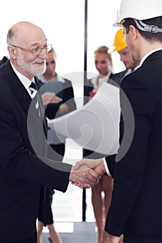 Handshake of architect and investor