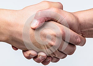 Handshake, arms friendship. Friendly handshake, friends greeting, teamwork, friendship. Close-up. Rescue, helping