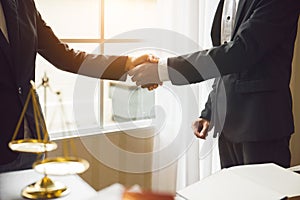 Handshake between attorneys and clients