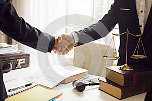 Handshake between attorneys and clients after agreeing