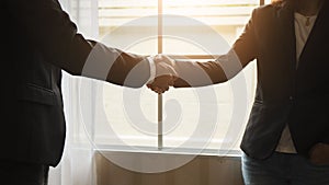 Handshake between attorneys and clients after agreeing to enter into a contract