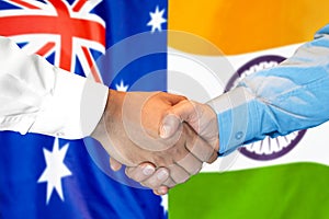 Handshake on Australia and India flag background