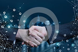 Handshake on the background of night streets .