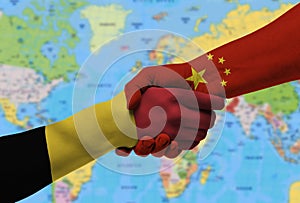 Handshake between Belgium and China flags