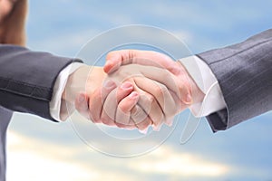 Handshake in the blue