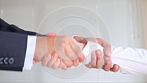 Handshake in business, man and woman shake hands. 4k, slow motion