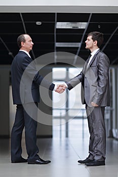 Handshake of business partners in the corridor of the office