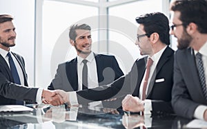 Handshake of business partners at a meeting in the office