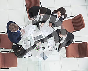 handshake of business partners before the talks near the desktop in