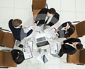 handshake of business partners before the talks near the desktop in