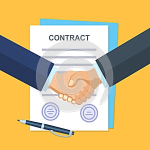 Handshake of business people on the background of the contract.