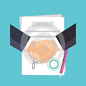 Handshake of business people on the background of the contract.
