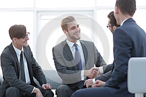 Handshake business people in the office.