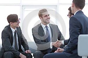 Handshake business people in the office.