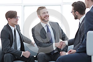 Handshake business people in the office.