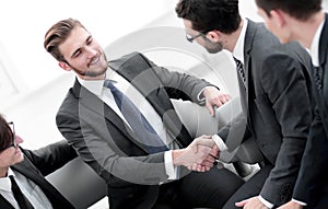 Handshake business people in the office.