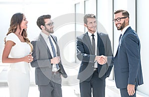 Handshake business people in the office