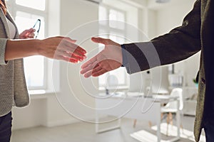 Handshake of businessmen. Female and male hand makes a handshake in the office.