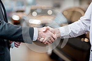Handshake of a client and salesperson