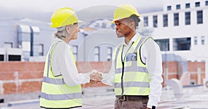 Handshake, construction site or engineering people in collaboration of maintenance building deal together. Mature woman