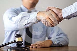 Handshake after consultation between a male lawyer and client, g