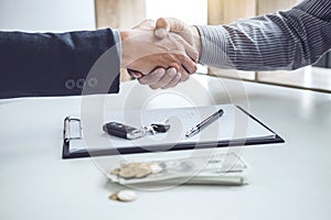 Handshake of cooperation customer and salesman after agreement,