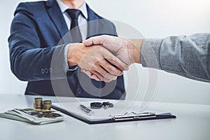 Handshake of cooperation customer and salesman after agreement,