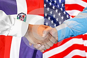 Handshake on Dominican Republic and US flag background. Support concept