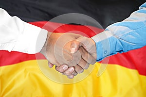 Handshake on Germany flag background