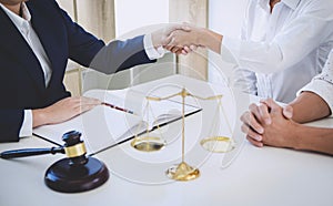 Handshake after good cooperation greeting, Having meeting with team at law firm, Consultation between a female lawyer and