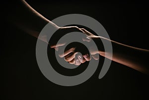 Handshake hand, arm on salvation. Close up help hand. Two hands, helping arm of a friend, teamwork. Rescue, helping