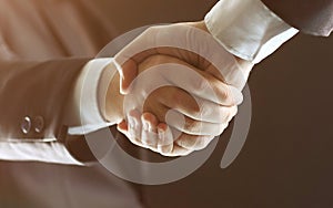 Handshake - Hand holding in the black background