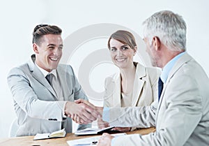 Handshake, happy business people or smile for partnership agreement or b2b deal in meeting. Shaking hands, start or