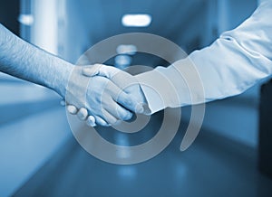 Handshake in the hospital corridor