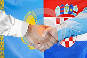 Handshake on Kazakhstan and Croatia flag background. Support concept in Republic of Croatia