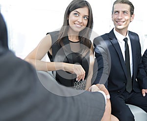 Handshake Manager and the client at a meeting in the office lobby.